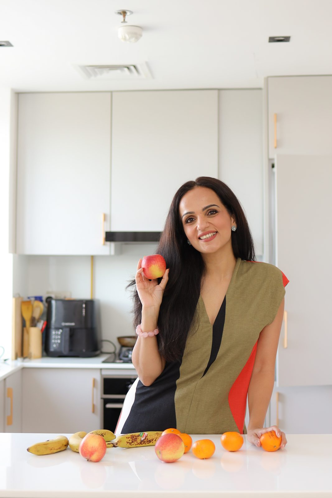 Zainab Hassan preparing food in a bright kitchen